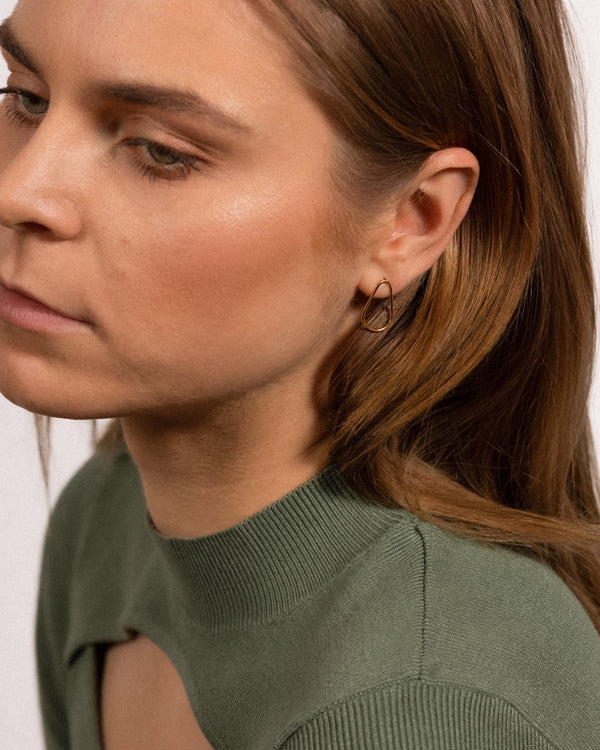 Model wearing Drop 24k gold vermeil Earring Studs.