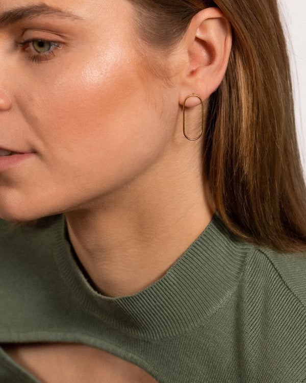 Model wearing Oval Earring Studs with 24k gold vermeil.